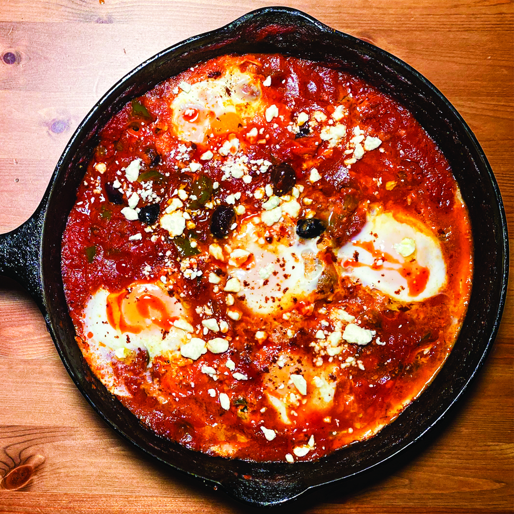 SHAKSHOUKA: North African Tomato and Pepper Stew with Cumin, Olives, and Whole Poached Eggs